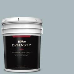 a white paint bucket with the words dynaasty on it's side