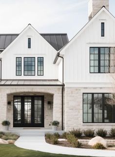 a large white house with two story windows