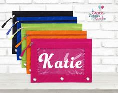 This listing is for a personalized pencil pouch. Names are adhered using premium vinyl. These pouches are great for storing your school or office supplies. Each 3 ring binder pencil pouch measures 10inches X 7 inches. Choose your pouch color as well as font choice and font choice from the dropdown menu. Rectangular Organizers For Back To School, Rectangular Student Organizer For Back To School, Customizable Rectangular Pencil Case For School, Multicolor Zipper Pouch Organizer For School, Customizable Pencil Case For Back To School, Customizable Rectangular Craft Supplies For Back To School, Back To School Zipper Pouch Craft Supplies, Customizable Educational Craft Supplies For School, Customizable Back To School Pencil Case