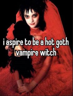 a woman in a red dress holding a doll with the caption i aspire to be a hot goth vampire witch