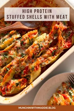 a casserole dish with cheese and vegetables in it on a white plate next to a wooden spoon