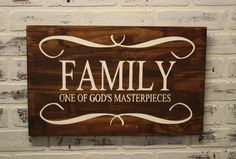 a wooden sign that says family one of god's masterpieces on the wall