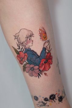 a woman's leg with tattoos on it and flowers around her ankles, holding a fire hydrant