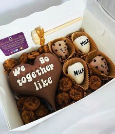 a box filled with cookies in the shape of hearts