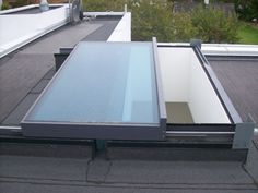 a flat screen tv mounted to the side of a roof