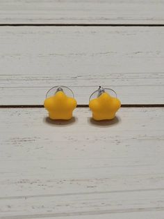 Yellow Star stud earrings are 1/2 inch wide. Posts are hypoallergenic and nickel free.