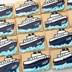 decorated cookies are arranged in the shape of boats