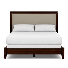 a bed with white sheets and pillows on top of it, against a white background