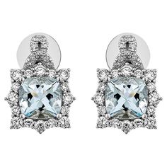 This collection features an array of Aquamarines with an icy blue hue that is as cool as it gets! Accented with Diamonds these Stud Earrings are made in White Gold and present a classic yet elegant look. Aquamarine Stud Earrings in 18Karat White Gold with White Diamond. Aquamarine: 2.39 carat, 7X7mm size, Cushion shape White Diamond: 0.255 carat, 1.60mm size, round shape, G color, VS clarity. White Diamond: 0.565 carat, 2.00mm size, round shape, G color, VS clarity. White Diamond: 0.098 carat, 1.00mm size, round shape, G color, VS clarity. Gold: 5.128g, 18Karat white Gold. Butterfly Pin and Push Back. E543