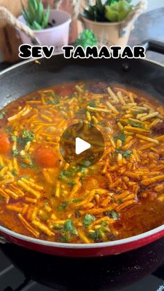 a pan filled with food sitting on top of a stove