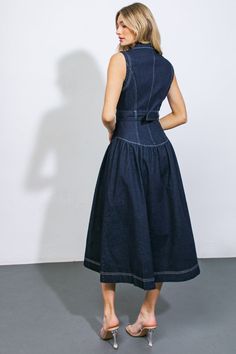 This exquisite denim midi dress boasts a lapel collar, sleeveless design, button front closure, self-tie belt, and a flattering drop waist.Details:Self : 70% Cotton 28% Polyester 2% SpandexSize & Fit- Model is 5`10" And Wearing Size Small- Measurements Taken From Size Small- Approx. Length: 50" Dark Denim Dress, Conservative Dress, Waist Tie Dress, Long Denim Dress, Casual Denim Dress, Teacher Dresses, Womens Denim Dress, Denim Midi Dress, Drop Waist Dress