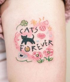 a woman's arm with a tattoo that says cats for ever and a cat on it