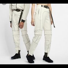 This Is A Rare And Brand New Pair Of The Ambush X Nike Collaboration Pant. These Sold Out Instantly And Have A Futuristic Tech Style. This Is A Unisex Xl With A Adjustable Belt. They Have Tags On And Have Never Been Worn. They Were Put Into Packing Boxes And Stored.