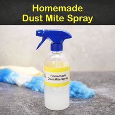 a bottle of homemade dust mitt spray sitting on top of a counter next to a blue mop