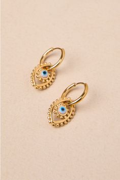 Bring a lucky vibe to all your outfits with the help of the Petit Moments Eye Time Gold Evil Eye Charm Huggie Hoop Earrings! Shiny, gold-toned metal shapes these striking earrings that have small, hinged huggie-style silhouettes that support evil eye charms with circular blue pupils and dot-like raised edges. Hinged post backs. Earrings measure 1" long. 95% Stainless Steel, 5% Glass. Imported. Lulus | Eye Time Gold Evil Eye Charm Huggie Hoop Earrings. Gold-tone Teardrop Hoop Earrings Gold Plated, Gold-tone Teardrop Gold Plated Hoop Earrings, Gold Metal Drop Cartilage Earrings, Dainty Metal Hoop Earrings, Nickel-free Gold Brass Huggie Earrings, Adjustable Gold-plated Nickel-free Hoop Earrings, Dainty Metal Nickel-free Huggie Earrings, Trendy Gold Plated Nickel-free Huggie Earrings, Trendy Nickel-free Gold-plated Huggie Earrings