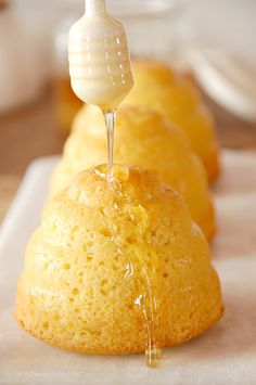 the bundts are being drizzled with honey on them and they are ready to be eaten