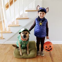 a little boy and his dog are dressed up as trick - or - treat characters