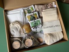 an open box containing socks, soap and other items