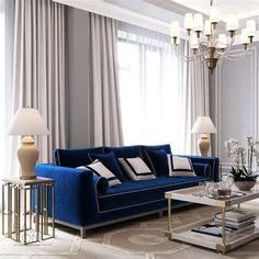 a living room filled with furniture and a chandelier