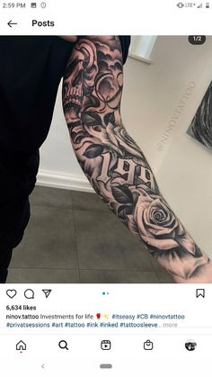 a man's arm with roses and skulls tattooed on the forearm, in black and white