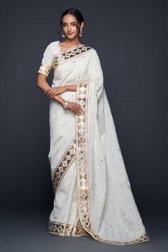 Off-white jamdani saree with gota applique embellishment in barfi pattern. - Aza Fashions White Chanderi Pre-draped Saree With Zari Work, Traditional Off White Chanderi Pre-draped Saree, Festive Off-white Cotton Silk Traditional Wear, White Cotton Silk Pre-draped Saree With Zari Work, White Pre-draped Saree With Zari Work For Eid, Traditional Cotton Silk Saree With Gota Work, Designer White Cotton Silk Dupatta, Semi-stitched Cotton Silk Saree With Mirror Work, Bollywood Cotton Silk Saree With Mirror Work