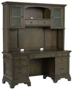 an office desk with hutch style cabinets and drawers on the top, in dark wood