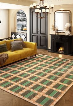 a living room filled with furniture and a rug on top of a hard wood floor