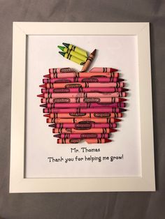 an apple made out of crayons with the words mr thomas thank you for helping me grow