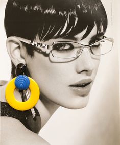 "Huge oversized yellow MOD retro vintage hoop earrings. They are big and very special! Made of beautiful vintage old plastic elements and very rare. Great with any outfit.  You must have this pair!  Buy them for your best-styled woman friend!  ♥Item Details: Length: 8 cm / 3.1 \" Width: 6.5 cm / 2.2 \"  Materials: vintage acrylic beads Colors: yellow, blue, black More hoop earrings: https://www.etsy.com/listing/483791734/ All earrings: https://www.etsy.com/shop/myfaunaflora?ref=seller-platform-m Mod Earrings, Retro Earrings, Oversized Earrings, Retro Earring, Yellow Earrings, Earrings Large, Earrings Hoop, Branded Gifts, Earrings Statement