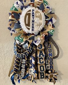 a football themed wreath hanging on the wall