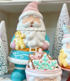 some christmas decorations are sitting on a shelf