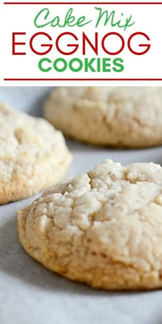 an eggnog cookie on a baking sheet with the words cake my eggnog cookies above it