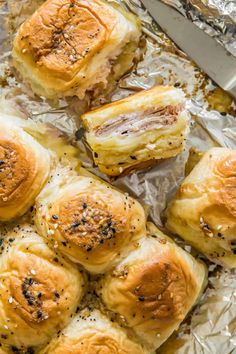 rolls with meat and cheese on tin foil