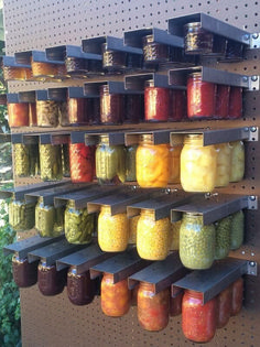 the shelves are filled with many different types of pickles and other food in jars