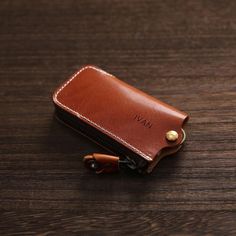 Description: Crafted with high-quality cowhide, this mini wallet offers a compact solution to keep your belongings well-organized. Whether you need a coin wallet, key pouch, or a case for your earphones, this small leather pouch is designed to meet your daily needs effortlessly.  This vintage leather car key case is a stylish and practical accessory for any car owner. The case features a zipper closure to keep your keys secure and a leather keychain holder for easy access. Made from high-quality leather, this key case is durable and will last for years to come. It makes a great Father's Day gift or a thoughtful present for any car enthusiast.  Size: - Height: 0.91inches (2.3 cm) - Width: 2.36 inches (6 cm) - Length: 4.61 inches (11.7cm) - Weight: 0.18lb  Note: 1. The personalized text shou Leather Coin Purse With Key Clip For Gift, Leather Coin Purse With Key Clip As Gift, Brown Leather Coin Purse With Key Clip, Brown Rectangular Coin Purse With Key Clip, Rectangular Brown Coin Purse With Key Clip, Leather Rectangular Coin Purse With Key Clip, Brown Coin Purse With Key Clip For Gift, Leather Brown Coin Purse With Key Clip, Brown Coin Purse With Key Clip As Gift