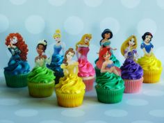 there are many cupcakes that have princesses on them in the same color