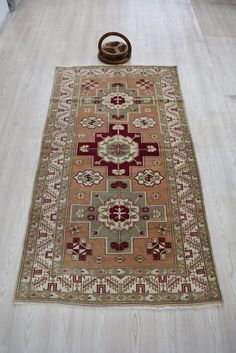 "Rug ID: 111 Origin : Turkey Size (inches): 75 x 40 inches Size (feet): 6'2\" x 3'3\" ft Size (meters): 190 x 103 cm Material : Wool - Cotton Condition: PERFECT - READY FOR USE Hello, we made an old Yoruk carpet Vintage by going through the processes. The pile height is shortened by shaving the carpet, which gains a more modern look. In this way, the weight of the carpet is slightly reduced and it becomes more useful. It is a clean carpet. One corner of this rug, which is made vintage, is thinner than the other corner. It is suitable for use, there is no problem, I just wanted to point out.  Welcome to my shop. * Payment method is etsy secure payment method. * We work with DHL - FEDEX - UPS . Your product will be delivered within 2-4 business days. * Our products are a member of our store. Clean Carpet, Carpet Decor, Carpet Vintage, Handmade Carpet, Turkey Size, Boho Dekor, Turkish Carpet, Vintage Carpet, Wool Carpet