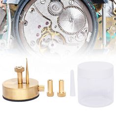 an image of the inside of a clock with screws and other accessories around it