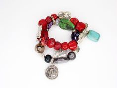 This vintage bracelet is a true gem, featuring chunky stones and an Alexander the Great coin. The red jasper and turquoise beads add a pop of color to any outfit, making it a perfect accessory for any occasion. You will receive: (What you see in the images) - 1 Chunky Stone Bracelet: Size 6" (This is stretchable so it can get much bigger) Contact me through Etsy messaging with any questions. All vintage items are hand picked for quality and uniqueness, so you can feel special wearing an authentic piece of the past. Thanks for shopping at Rose & Lily's, check back often for new vintage treasures. Red Gemstone Beaded Bracelet Bohemian Style, Adjustable Eclectic Red Jewelry, Bohemian Red Bracelets With Large Beads, Red Bohemian Bracelet With Natural Stones, Red Bohemian Crystal Bracelet With Round Beads, Bohemian Red Bracelet With Natural Stones, Red Bohemian Beaded Gemstone Bracelet, Bohemian Red Crystal Bracelet With Round Beads, Vintage Round Jade Bracelets