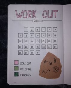 a work out tracker is shown in a notebook