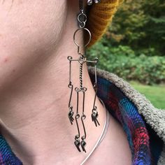 These Black Hematite dangly wire wrapped skeleton earrings are one of a kind! They are the absolute perfect Halloween jewelry that will go with absolutely anything, even after the Holiday! These little skeletons dangle in the breeze making tiny wind chime sounds while you move around, they go to about the middle of the neck to top shoulder.  The ear wire is made of hematite coated copper if you need something like antiqued sterling silver or sterling silver please choose that option in the variations. If you need stainless steel send me a message and I can do that for you! * Every piece I create is unique and one of a kind. I do not mass produce pieces, I make them one at a time with different details and lines in everyone, some might be similar but none of them are the same. When you buy Weave Art, Skeleton Earrings, Bijoux Fil Aluminium, Earrings Halloween, Wire Jewelry Designs, Art Earrings, Earrings Wire, Diy Wire Jewelry, Unique Halloween