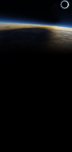 an eclipse seen from space with earth in the background