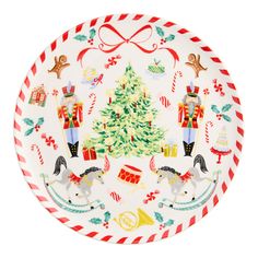 a plate with christmas decorations on it and a tree in the center, surrounded by other holiday items