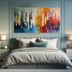 a large painting on the wall above a bed