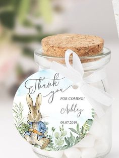 a jar filled with marshmallows and a thank you tag