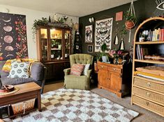 a living room filled with furniture and lots of plants on top of it's shelves