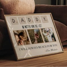 a sign that says daddy on it next to a couch