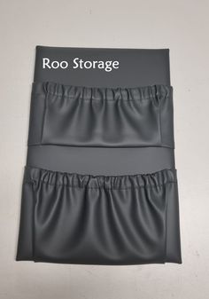 two black bedspreads with the words roo storage on them