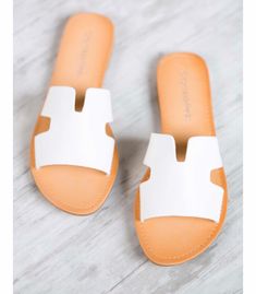 Adorable white slip-on flat sandals with cut-out detail & faux leather strap. These run small, so size up! White Slip, Flat Sandals, Slip On Sandal, Leather Straps, Cut Out, Faux Leather, Walking, Slip On, Couture