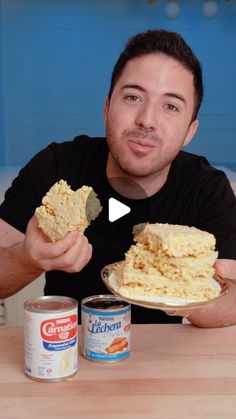 a man holding a plate with food on it and peanut butter in front of him